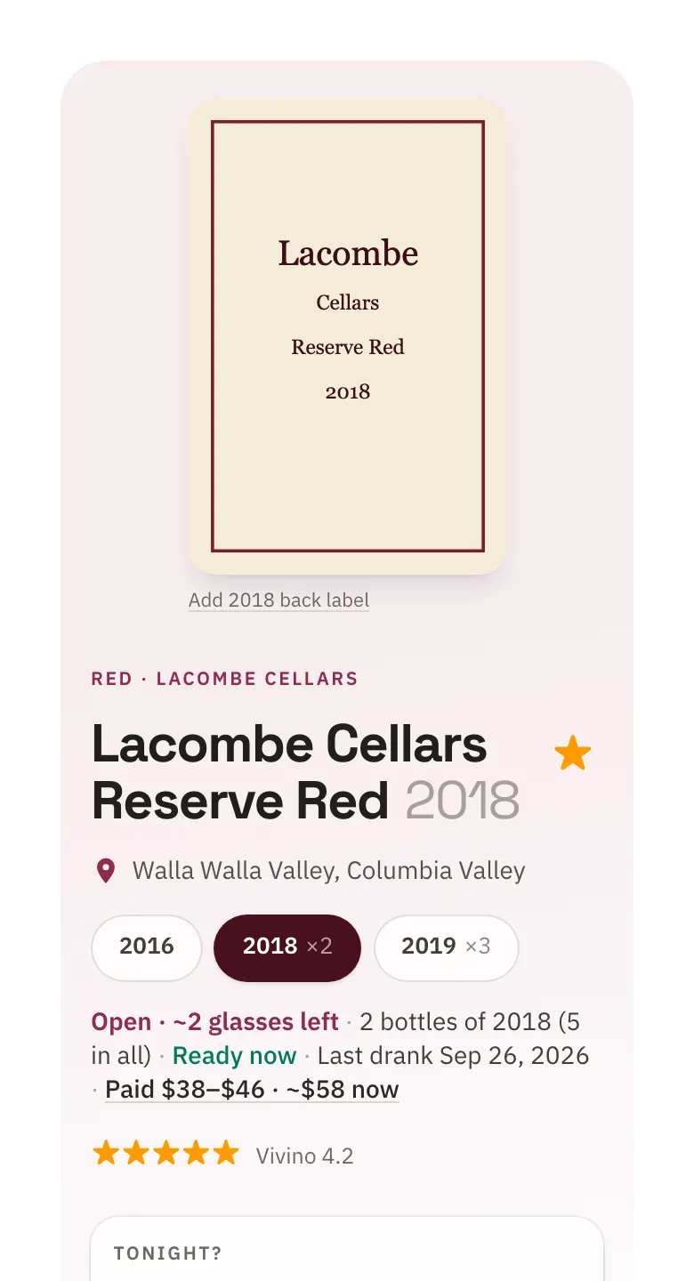 A wine's page in Junior: the Lacombe Cellars Reserve Red 2018 label, its vintages, an open bottle with about two glasses left, ready now, what was paid and what it costs now.